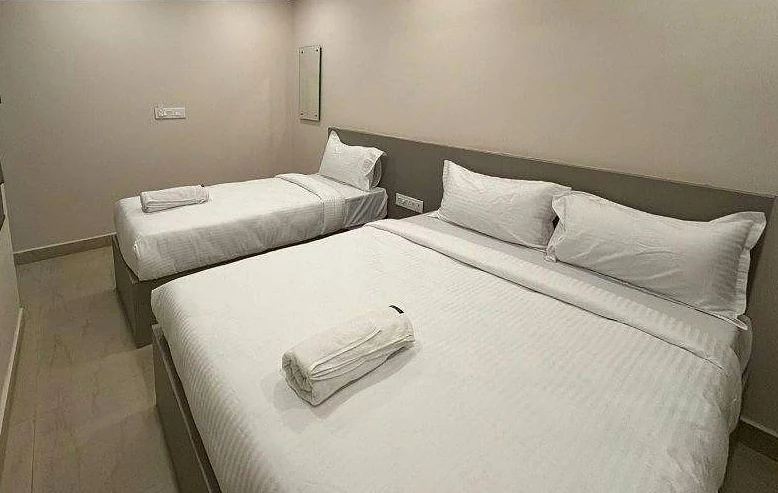 Triple Bed room, beds and TV